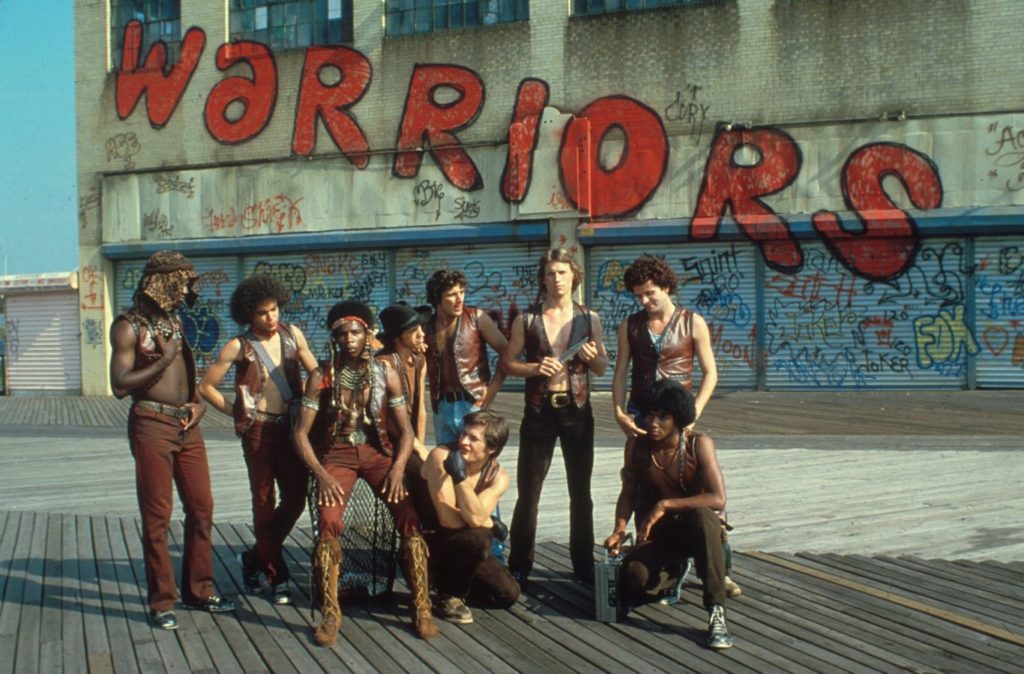 Walter Hill's The Warriors. Imagine them, I suppose, in banana yellow leather vests. 